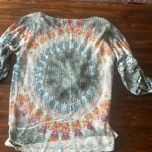 Unique textured top for small or medium with some shiny speckle in front.